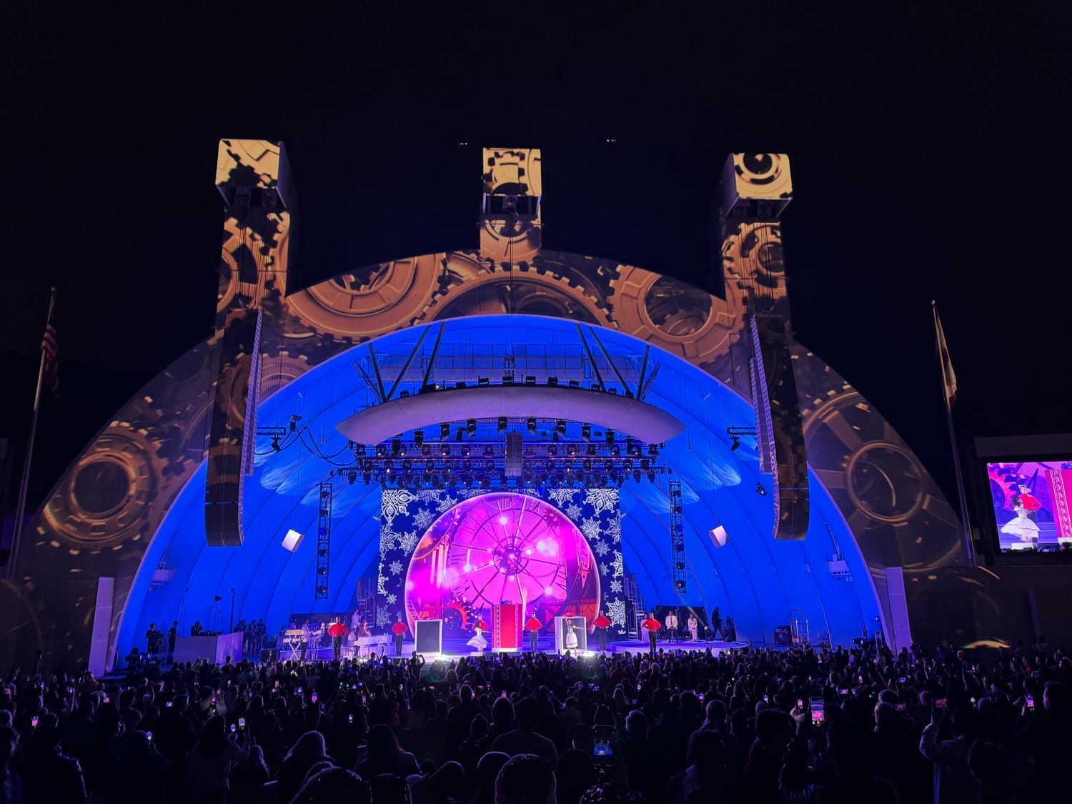 Mariah Carey’s Merry Christmas tour — a domed stage lit blue and purple with projection, the crowd gathered below.