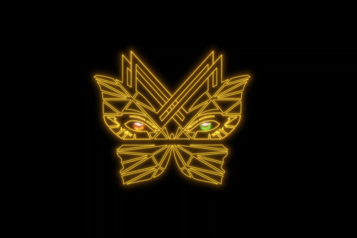 The Modelland mark in gold neon on black — a butterfly whose upper wings form a mask around two eyes, one amber and one green.